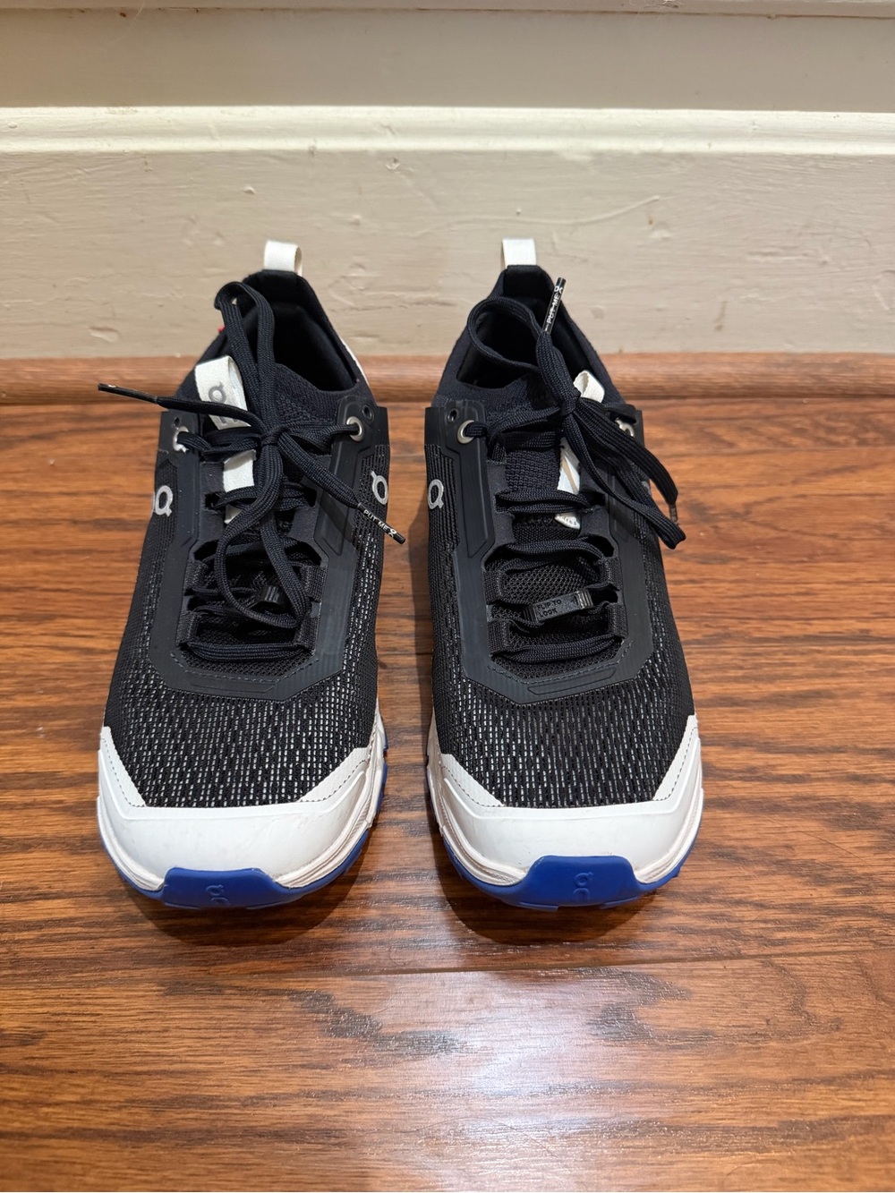 On Running Black White Athletic Sneakers with Blue Toe Detail